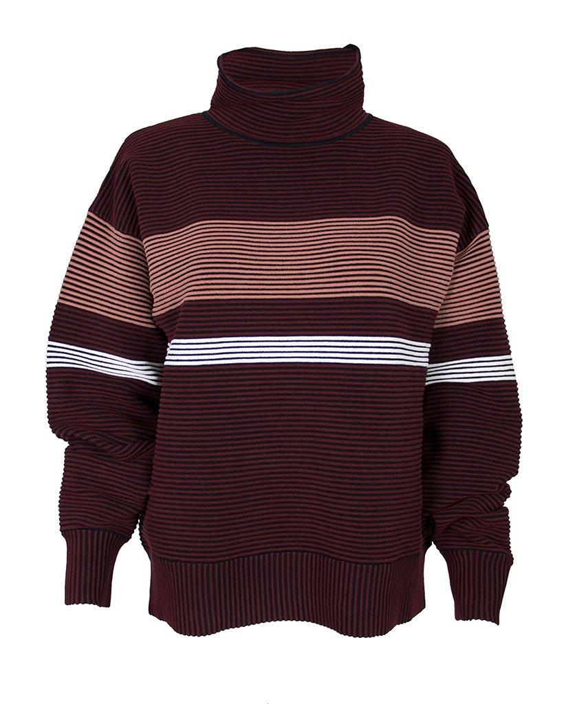 Female model wears the Nagnata Retro Rib Sweater in burgundy and blue, and the Yoni Short in lilac