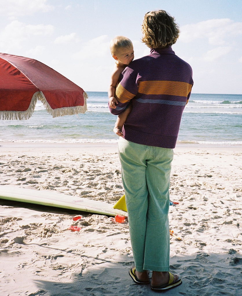Female model wears the Nagnata Retro Rib Sweater in purple haze and tangerine