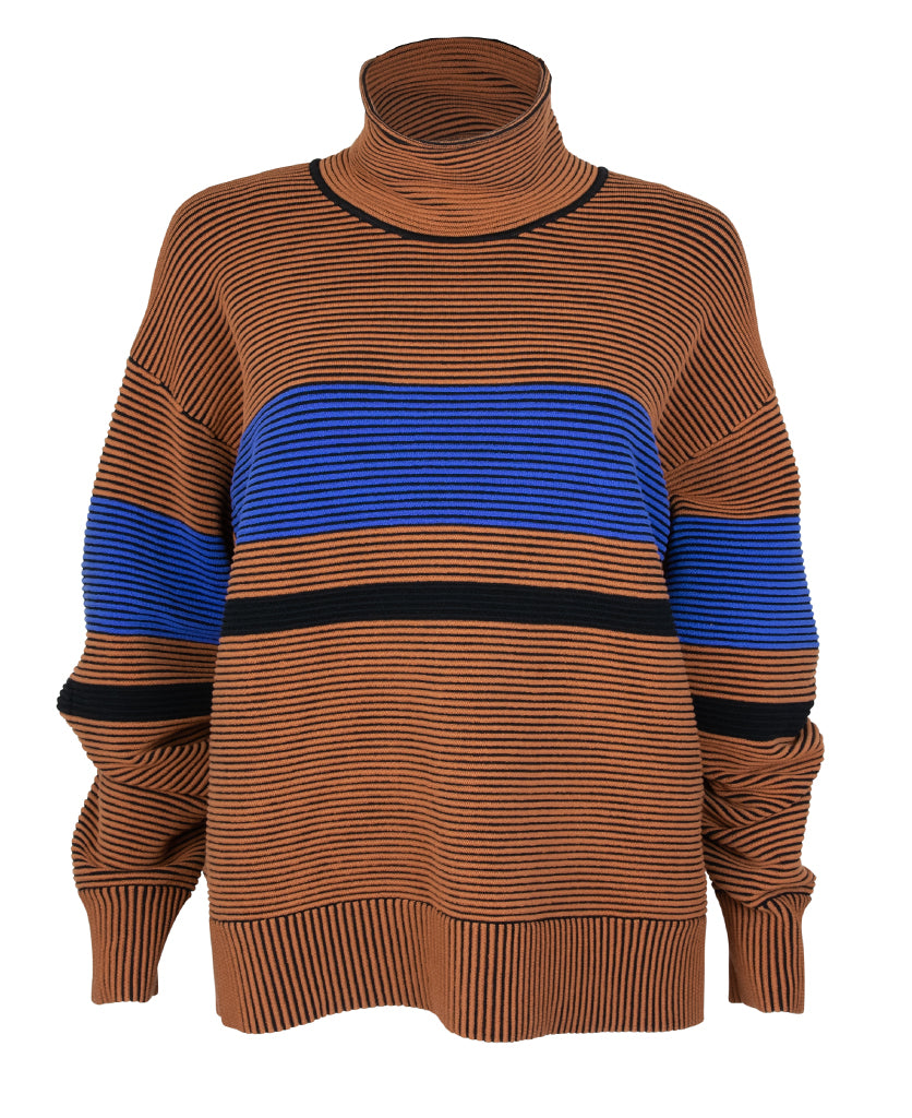 Female model wears the Nagnata Retro Rib Sweater in bronze and azure blue