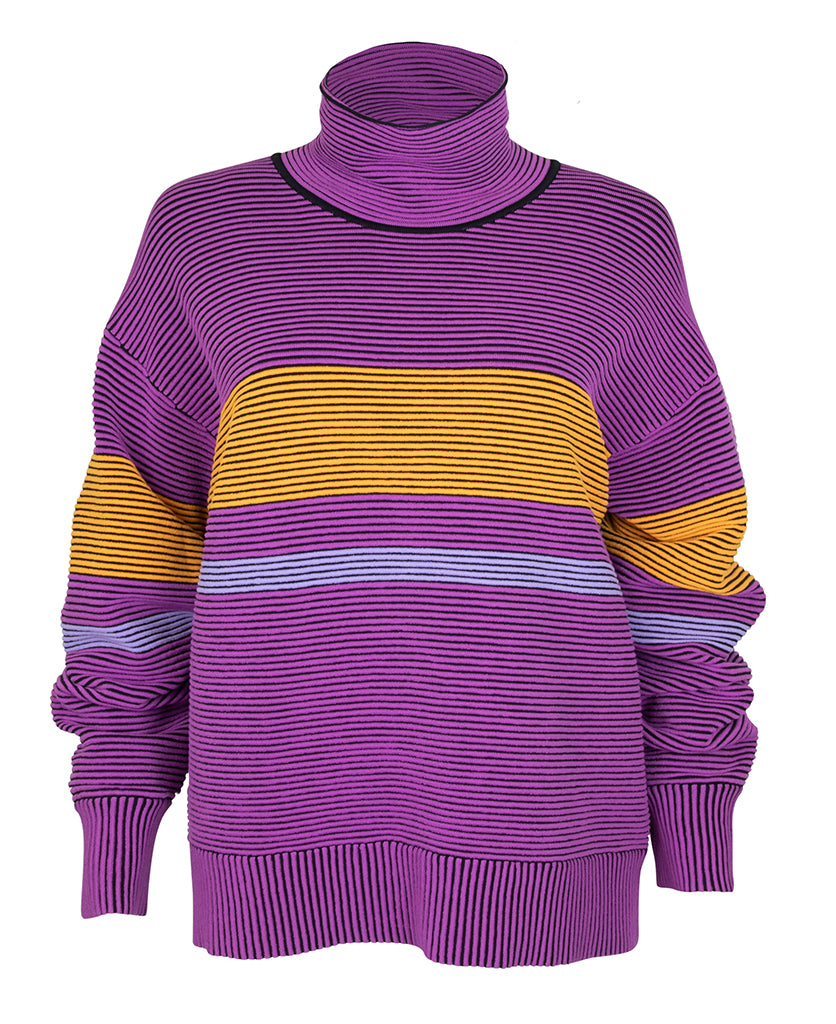 Female model wears the Nagnata Retro Rib Sweater in purple haze and tangerine