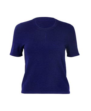 Female model wears the Nagnata Merino Trash Tee in indigo
