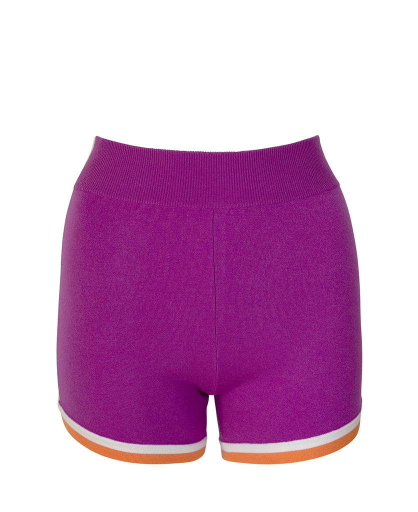 Female model wears the Nagnata Retro Short in purple haze, cream and orange