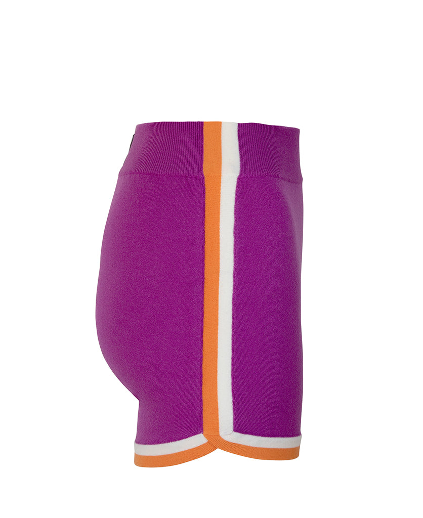 Female model wears the Nagnata Retro Short in purple haze, cream and orange