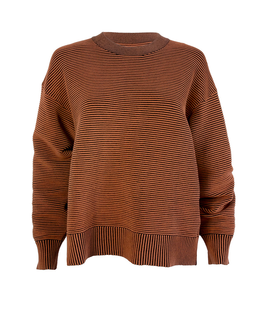 Male model wears the Nagnata Sonny Crew Neck Sweater in bronze and black